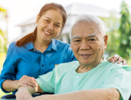 caregiver and senior man in a wheelchair