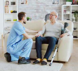 aide talking to an elderly