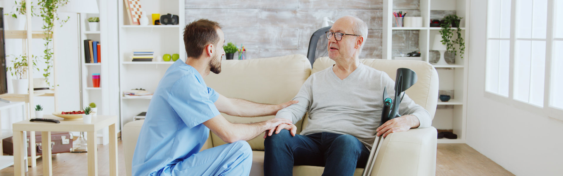 aide talking to an elderly