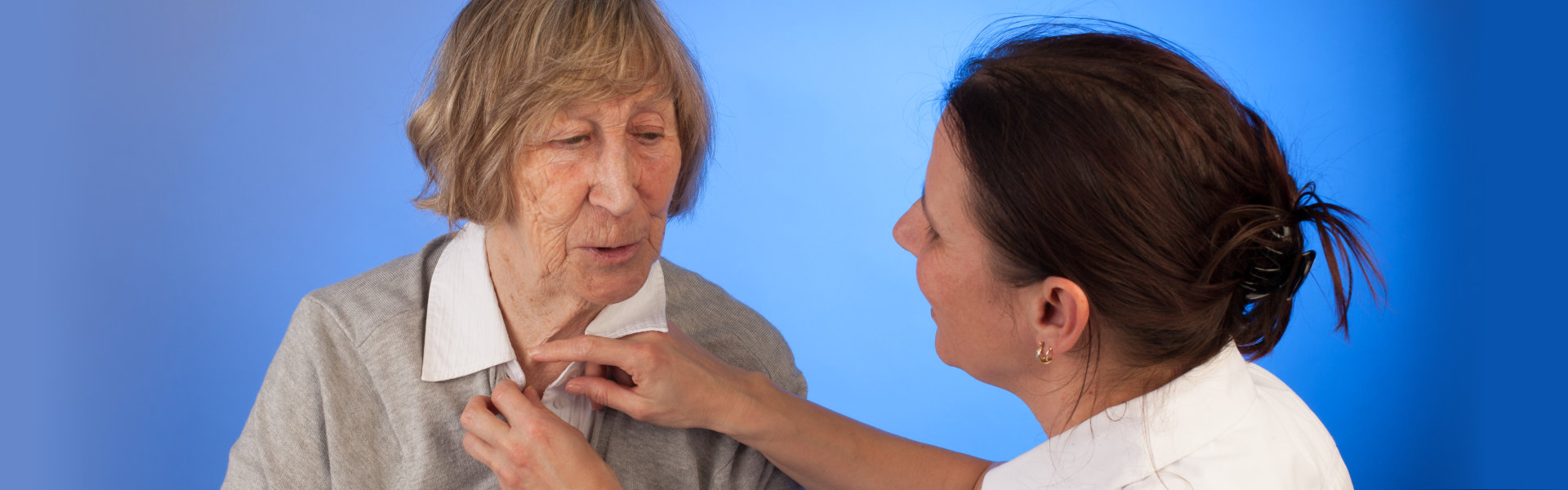 healthcare worker assisting senior woman